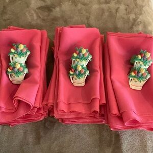 Cloth dinner napkins (29 total) with six decorative rings.